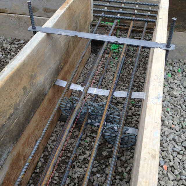 Forming_concrete_footing_8_runs_rebar_continuous